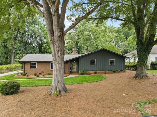 3701 Table Rock Rd, Charlotte, NC 28226 - ranch-style home featuring board and batten siding, brick siding, a chimney, and a front yard