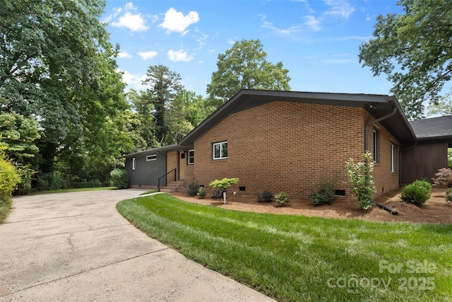 3701 Table Rock Rd, Charlotte, NC 28226 - view of home's exterior with crawl space, entry steps, a yard, concrete driveway, and brick siding