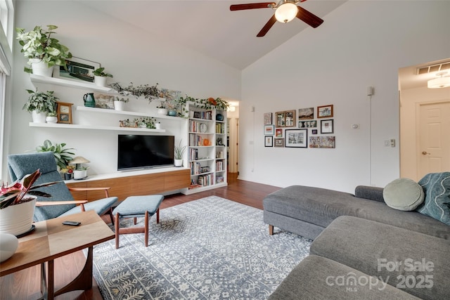 11615 Chadburn Ln, Charlotte, NC 28215 - living room featuring high vaulted ceiling, ceiling fan, and wood finished floors