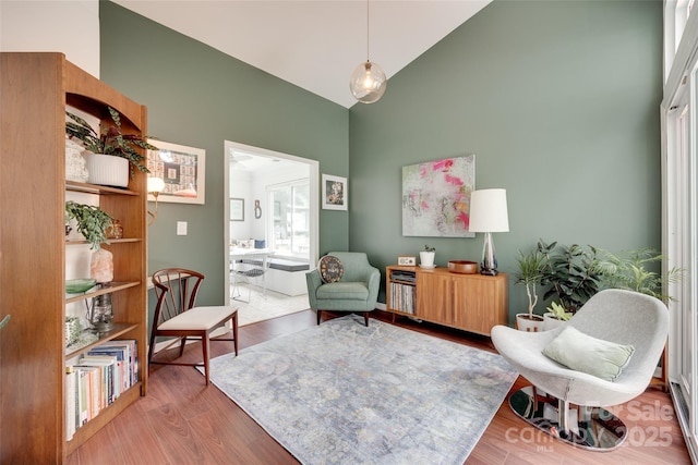 11615 Chadburn Ln, Charlotte, NC 28215 - living area featuring high vaulted ceiling and wood finished floors