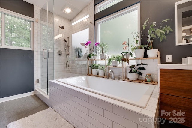 11615 Chadburn Ln, Charlotte, NC 28215 - bathroom featuring a shower stall, vanity, healthy amount of natural light, and a bath
