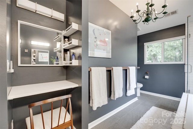 11615 Chadburn Ln, Charlotte, NC 28215 - bathroom with a chandelier, tile patterned flooring, and a shower
