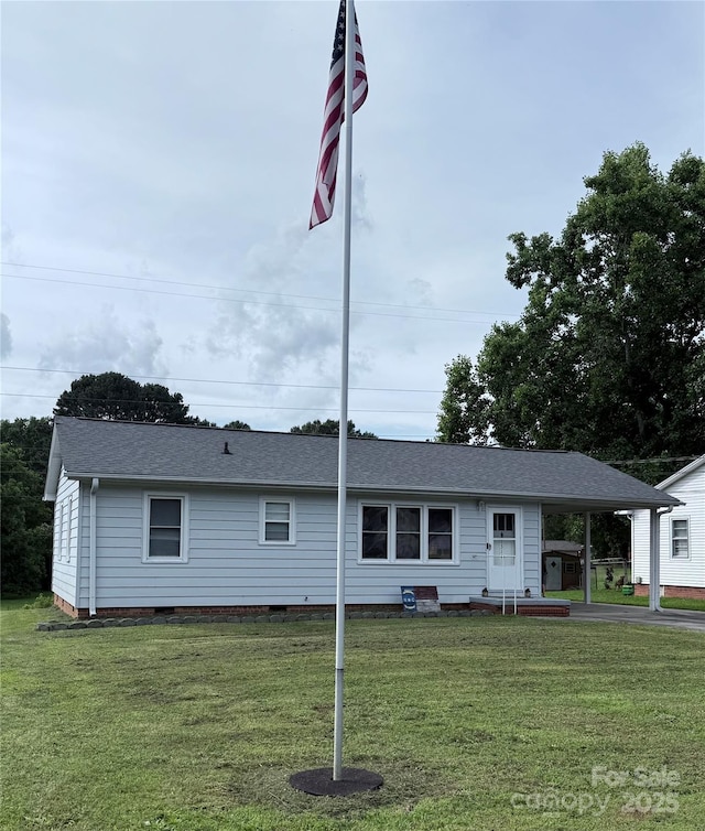 1314 Hathcock Ave, Albemarle, NC 28001 - view of front facade with a front yard, a carport, a shingled roof, and crawl space