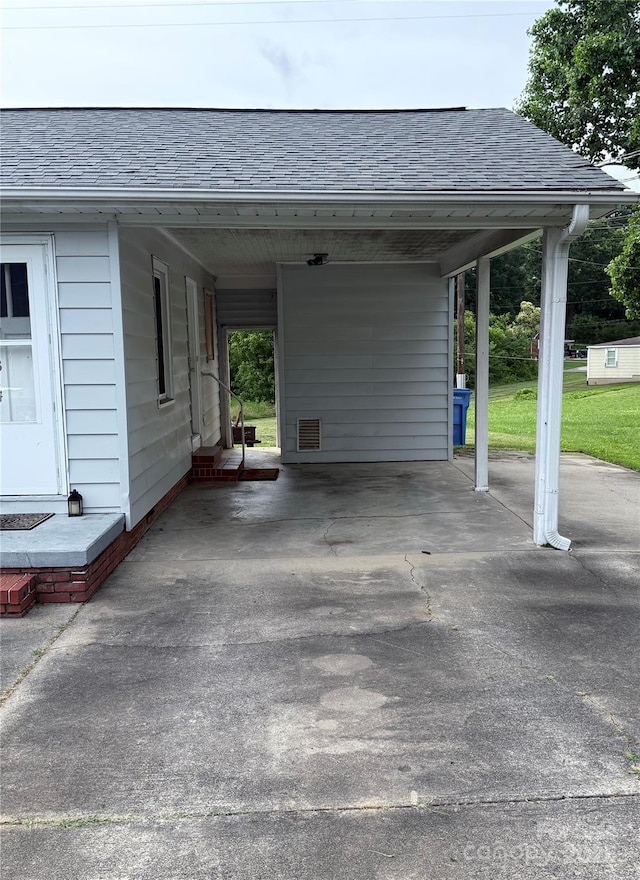 1314 Hathcock Ave, Albemarle, NC 28001 - view of parking featuring concrete driveway and a carport