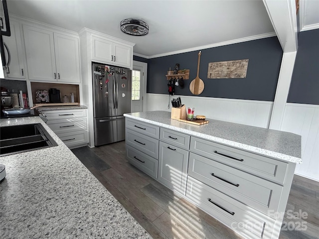 1314 Hathcock Ave, Albemarle, NC 28001 - kitchen with freestanding refrigerator, ornamental molding, dark wood-style floors, a wainscoted wall, and white cabinetry