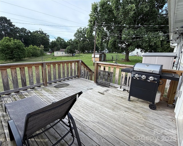 1314 Hathcock Ave, Albemarle, NC 28001 - wooden deck with a storage unit, a yard, and grilling area