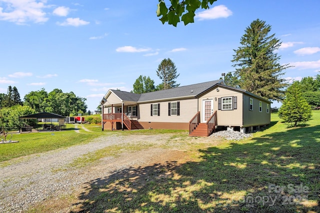 32 Bishop Ln, Flat Rock, NC 28731 - view of front of property with driveway, a front lawn, and a detached carport