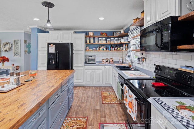 32 Bishop Ln, Flat Rock, NC 28731 - kitchen featuring black appliances, butcher block countertops, open shelves, crown molding, and white cabinets