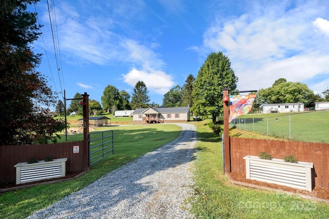 32 Bishop Ln, Flat Rock, NC 28731 - view of dirt / gravel road with a gated entry and a gate