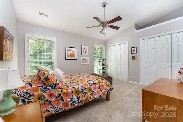 330 Stonehollow Rd, Fletcher, NC 28732 - bedroom featuring light carpet, lofted ceiling, multiple closets, and a ceiling fan