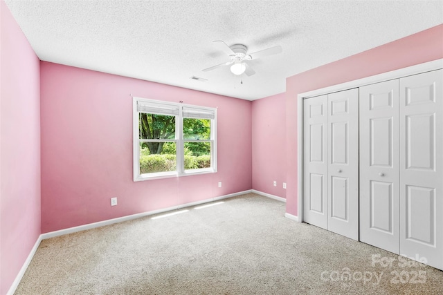 1958 Cameron Heights Cir, Denver, NC 28037 - unfurnished bedroom featuring carpet flooring, a textured ceiling, a ceiling fan, and a closet