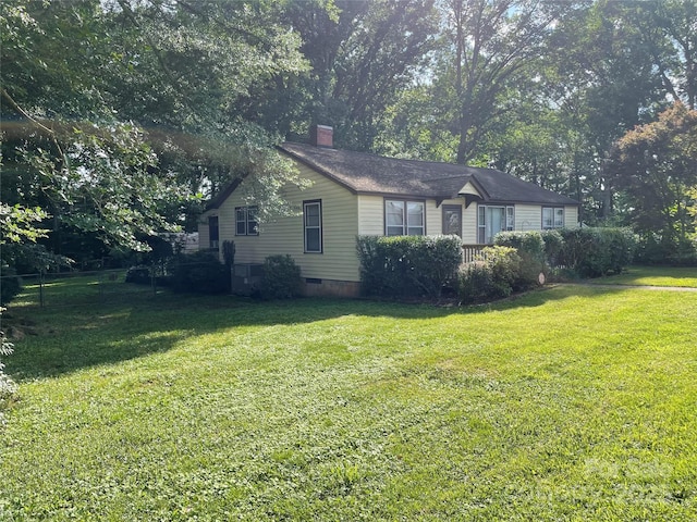 2411 Rebecca Ave, Charlotte, NC 28208 - view of side of property with a lawn, a chimney, and crawl space