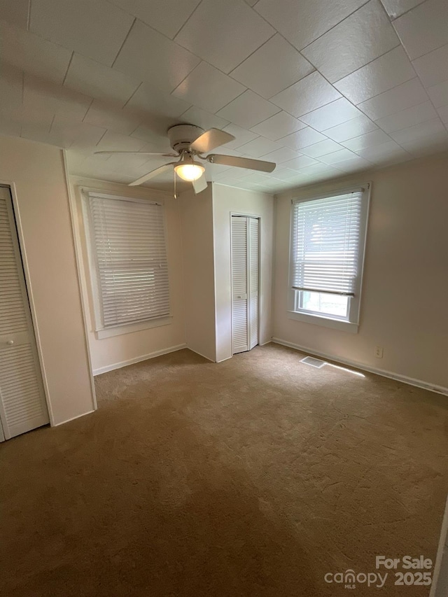 2411 Rebecca Ave, Charlotte, NC 28208 - carpeted spare room featuring ceiling fan and baseboards