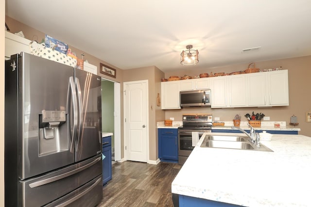 903 Von Buren Blvd, Rock Hill, SC 29730 - kitchen featuring stainless steel appliances, blue cabinets, light countertops, and dark wood-style floors
