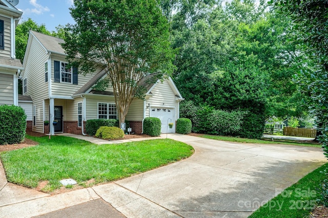 4703 David Cox Rd, Charlotte, NC 28269 - view of front of property featuring concrete driveway, a garage, and brick siding