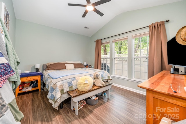 4703 David Cox Rd, Charlotte, NC 28269 - bedroom with lofted ceiling, wood finished floors, and a ceiling fan
