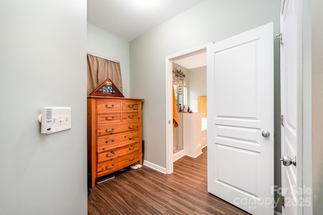 4703 David Cox Rd, Charlotte, NC 28269 - bedroom with dark wood-style floors and baseboards