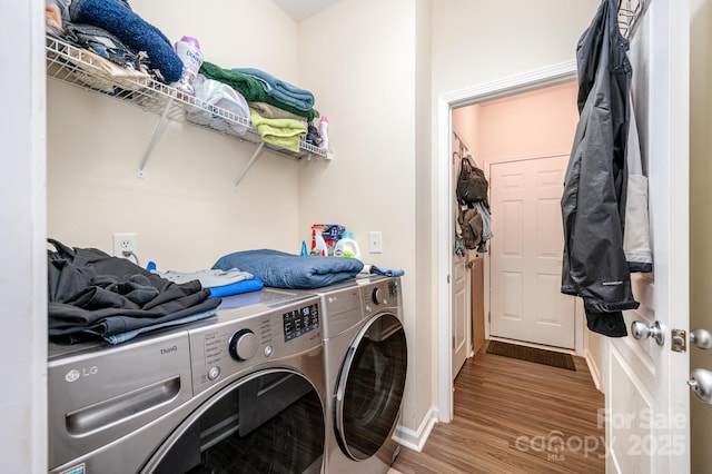 4703 David Cox Rd, Charlotte, NC 28269 - laundry area featuring washing machine and clothes dryer and wood finished floors