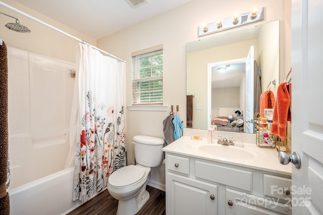 4703 David Cox Rd, Charlotte, NC 28269 - bathroom featuring vanity, wood finished floors, and shower / tub combo