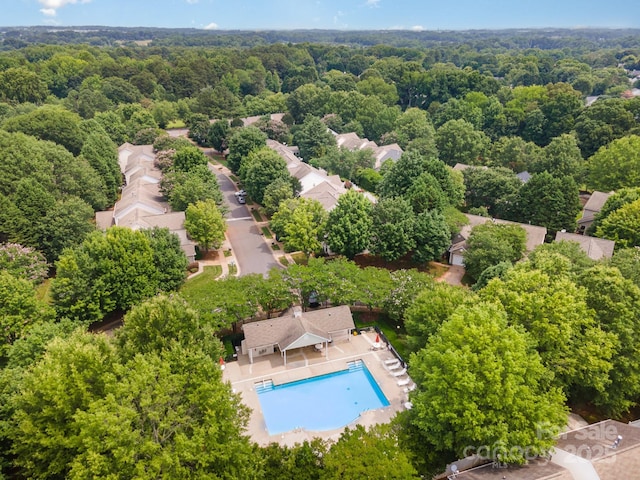 4703 David Cox Rd, Charlotte, NC 28269 - aerial view of a pool area and a heavily wooded area