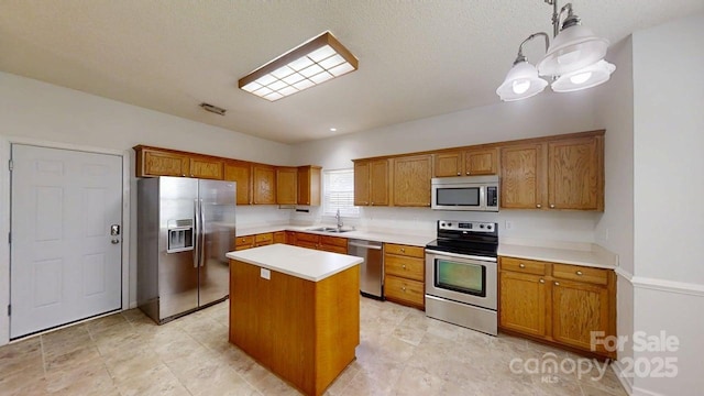 15280 Leslie Brook Rd, Huntersville, NC 28078 - kitchen featuring stainless steel appliances, brown cabinets, a center island, and light countertops