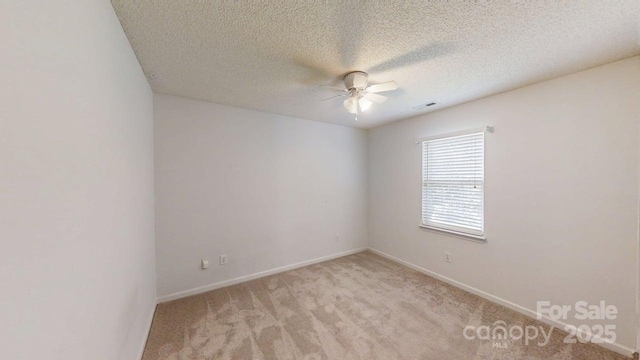 15280 Leslie Brook Rd, Huntersville, NC 28078 - spare room featuring a ceiling fan, light colored carpet, and a textured ceiling