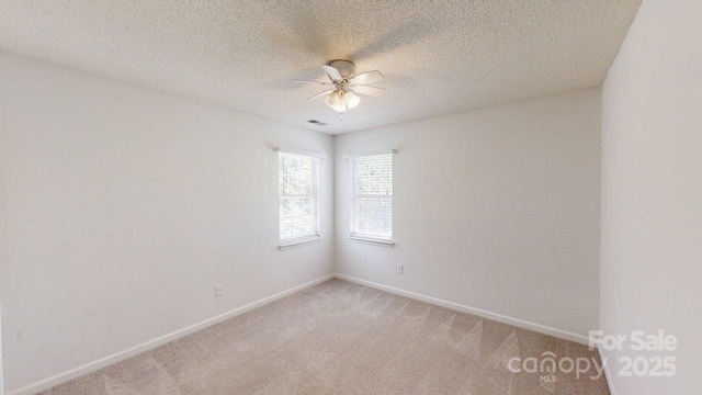 15280 Leslie Brook Rd, Huntersville, NC 28078 - empty room featuring ceiling fan, light colored carpet, and a textured ceiling