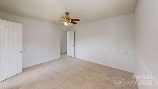 15280 Leslie Brook Rd, Huntersville, NC 28078 - carpeted spare room featuring a ceiling fan and baseboards
