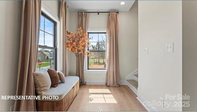 732 Falling Oak Aly Unit 22, Huntersville, NC 28078 - entryway featuring healthy amount of natural light, light wood-type flooring, and stairs