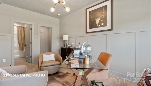 732 Falling Oak Aly Unit 22, Huntersville, NC 28078 - home office with a decorative wall, a chandelier, wainscoting, and lofted ceiling