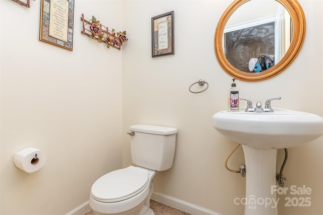 2133 Highland View Ln, Charlotte, NC 28214 - half bathroom with baseboards and tile patterned floors