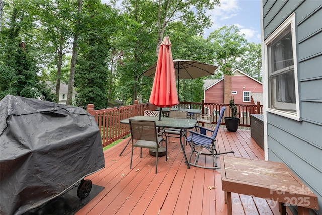 2133 Highland View Ln, Charlotte, NC 28214 - wooden deck with grilling area and outdoor dining space