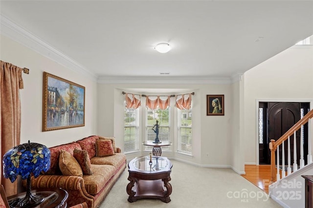 4966 Riverview Dr, Harrisburg, NC 28075 - living room featuring ornamental molding, stairway, and light colored carpet