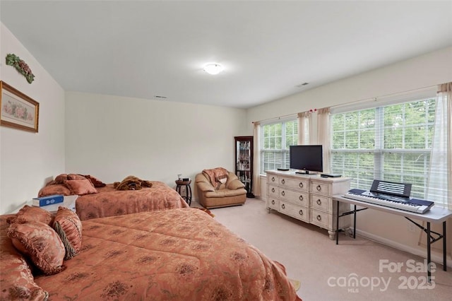 4966 Riverview Dr, Harrisburg, NC 28075 - bedroom featuring light carpet and baseboards
