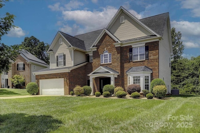 4966 Riverview Dr, Harrisburg, NC 28075 - view of front of home featuring brick siding, a garage, a front lawn, and driveway
