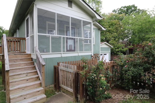 9 Oakland St, Weaverville, NC 28787 - view of side of property featuring stairs, a sunroom, and a garage