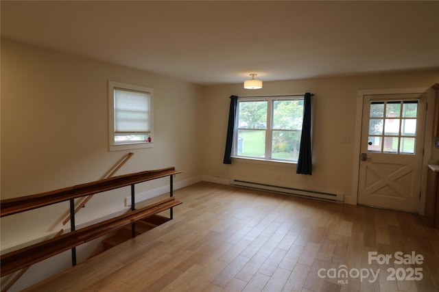 9 Oakland St, Weaverville, NC 28787 - foyer featuring a baseboard radiator and light wood-style flooring