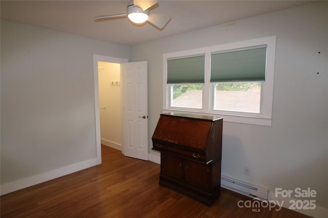 9 Oakland St, Weaverville, NC 28787 - spare room with a baseboard heating unit, dark wood-type flooring, and ceiling fan