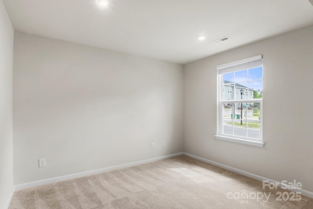 1204 May Apple Dr, Matthews, NC 28104 - unfurnished room with light colored carpet and recessed lighting