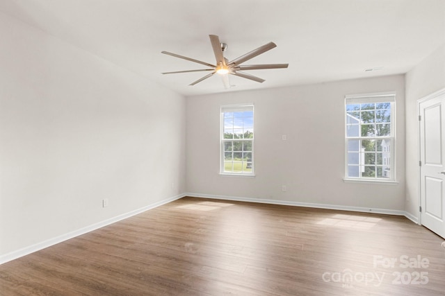1204 May Apple Dr, Matthews, NC 28104 - spare room featuring healthy amount of natural light, a ceiling fan, and wood finished floors