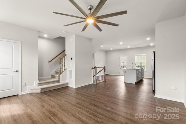 1204 May Apple Dr, Matthews, NC 28104 - unfurnished living room with ceiling fan, dark wood-style flooring, and recessed lighting