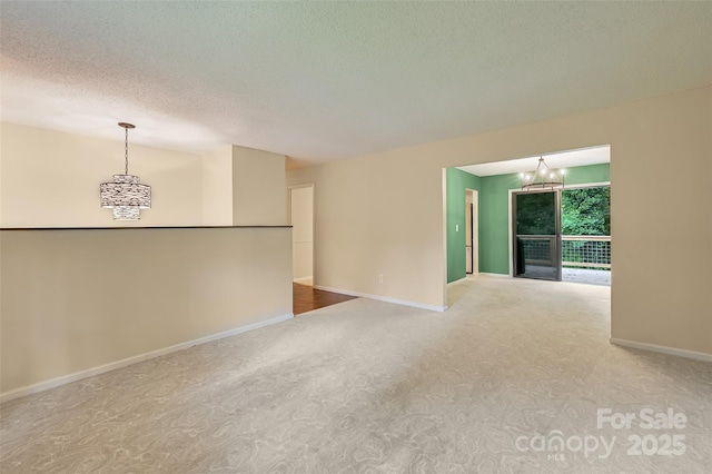 18 Golden Oaks Ln, Fletcher, NC 28732 - carpeted spare room featuring a chandelier and a textured ceiling