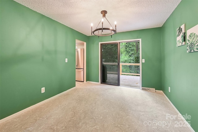 18 Golden Oaks Ln, Fletcher, NC 28732 - unfurnished room with a chandelier, a textured ceiling, and carpet floors