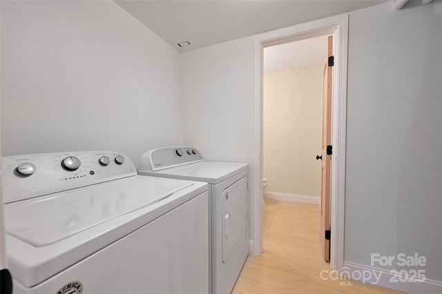 18 Golden Oaks Ln, Fletcher, NC 28732 - laundry room with independent washer and dryer and light wood finished floors