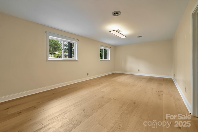 18 Golden Oaks Ln, Fletcher, NC 28732 - spare room with plenty of natural light and light wood-style floors