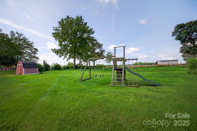 5445 Creekwood Dr, Salisbury, NC 28147 - view of jungle gym featuring a storage shed and a yard