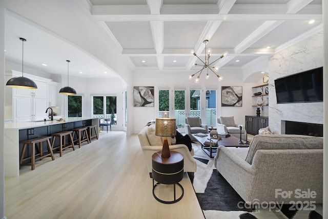 8016 Pemswood St, Charlotte, NC 28277 - living area featuring beamed ceiling, light wood finished floors, recessed lighting, coffered ceiling, and a chandelier