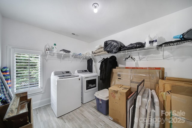 8016 Pemswood St, Charlotte, NC 28277 - laundry room with washer and clothes dryer and light wood finished floors