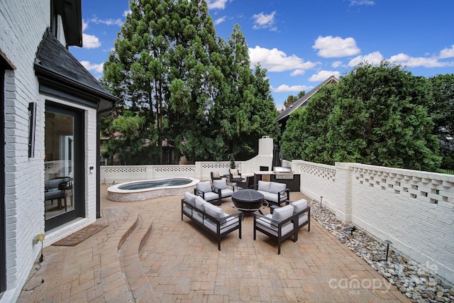 8016 Pemswood St, Charlotte, NC 28277 - view of patio / terrace featuring an in-ground hot tub, a grill, and an outdoor living space with a fire pit