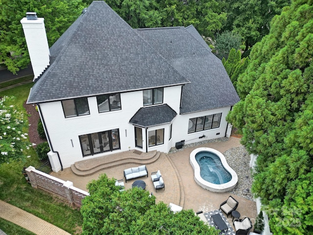 8016 Pemswood St, Charlotte, NC 28277 - rear view of property featuring a shingled roof, a patio area, a chimney, outdoor lounge area, and a fenced backyard